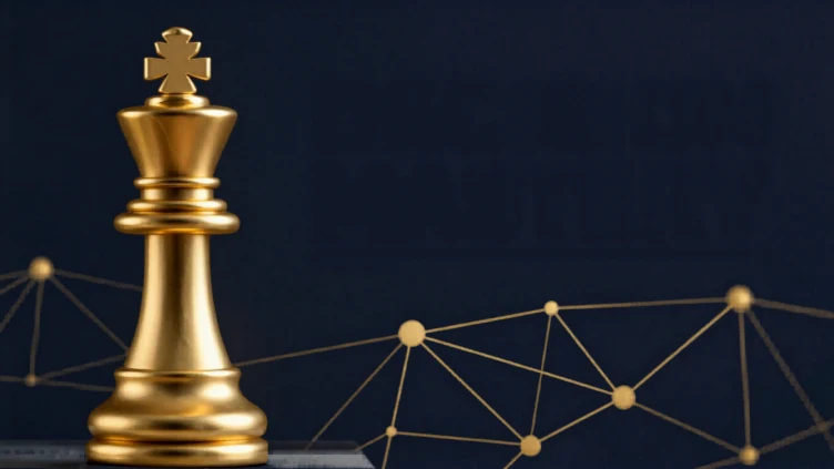 A gold chess king beside a network of connected points